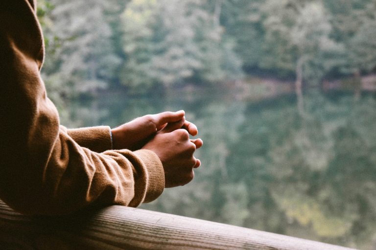 Image of a person by themselves to represent self-compassion in a scenery that is soothing